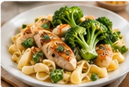 A finished chicken, broccoli, and pasta meal